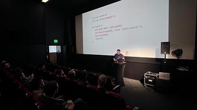Chris presenting with code on the screen